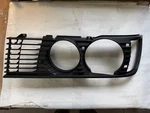 Bmw E23 Sedan Headlight Front Lamp Black Grille Right 51131900272 New Old Stock. Fixed Price $250.00.